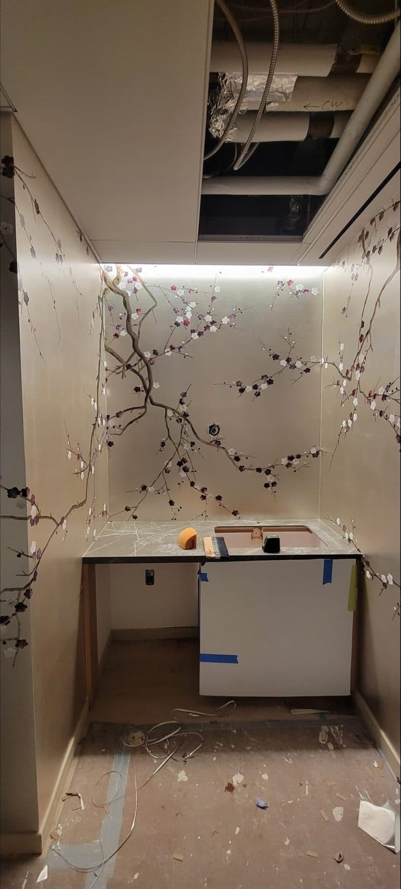 Cherry blossom mural wrapping a pantry alcove