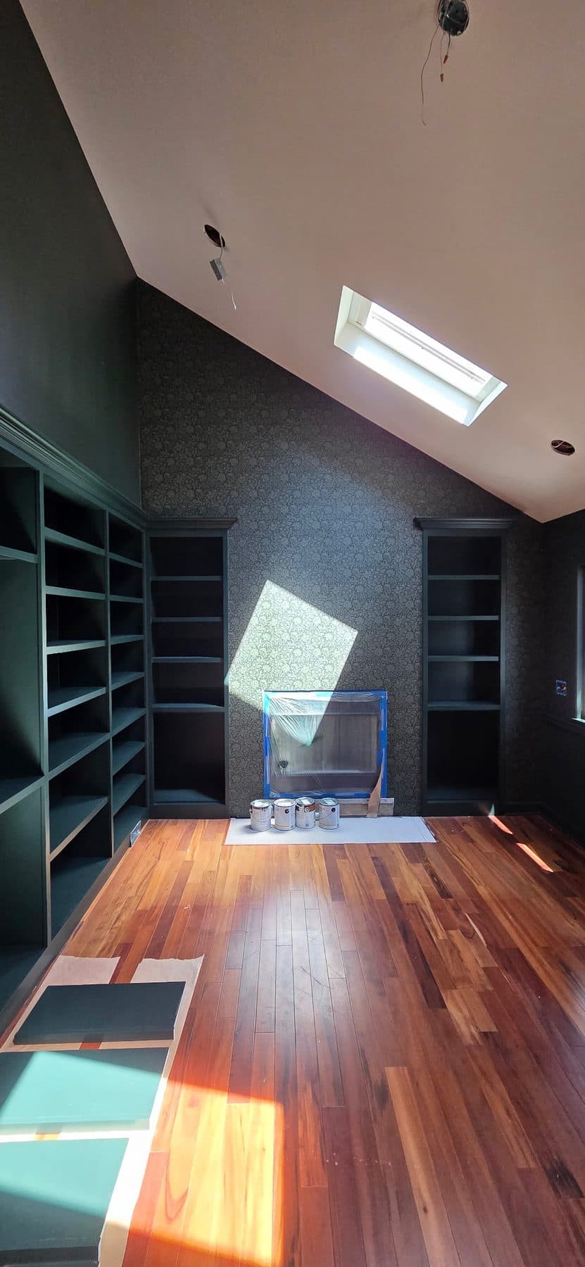 Deep navy grasscloth in a home library