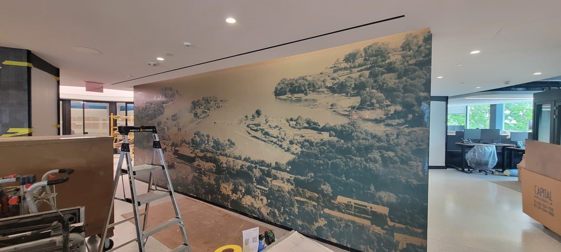 Scenic mural off an open kitchen